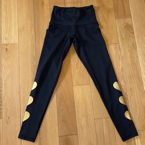 Strut this black leggings with gold hearts OS